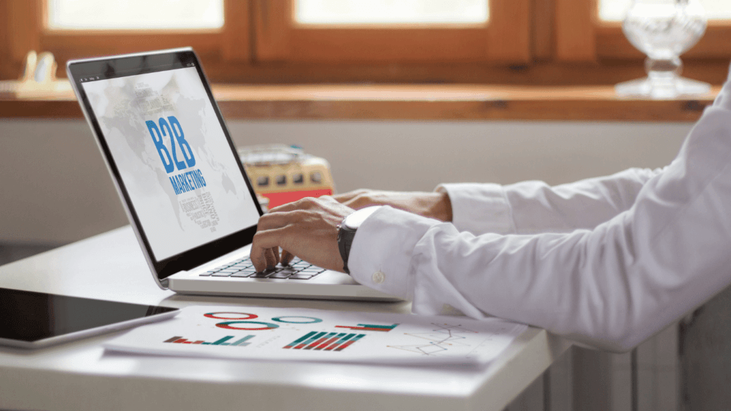 A person using a laptop to develop a B2B social selling strategy