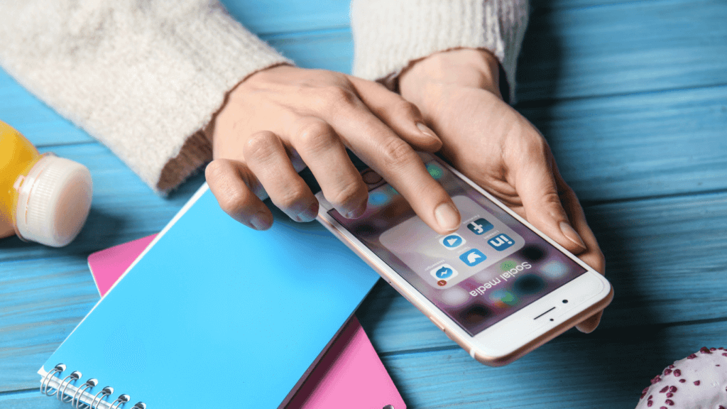 An image showing a person using social media for social selling strategy