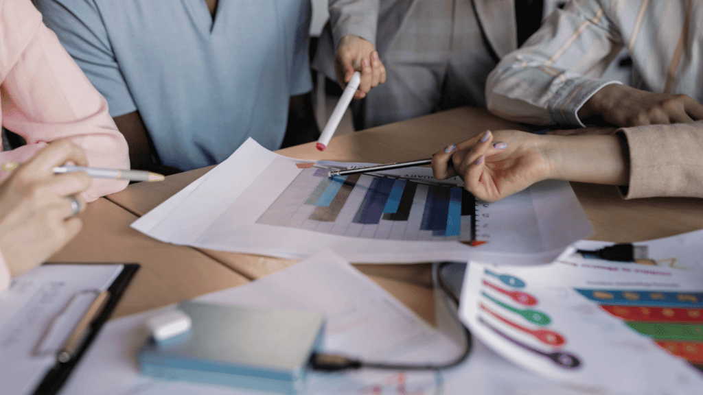 A group of business leaders discussing the importance of sales forecasting