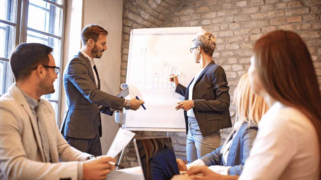 A group of business leaders discussing best practices for sales forecasting