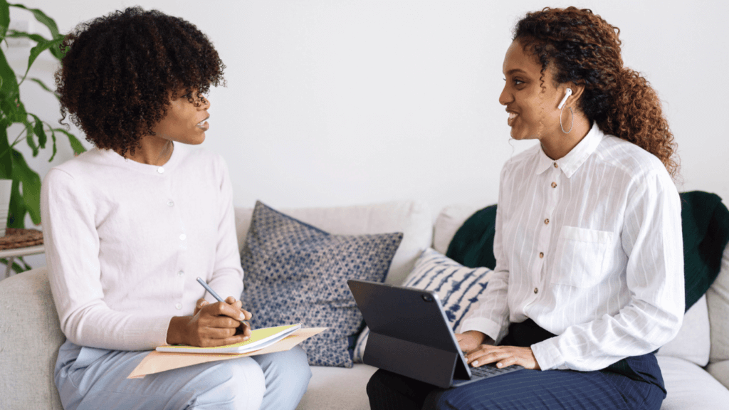 Two sales professionals discussing a sales discovery process