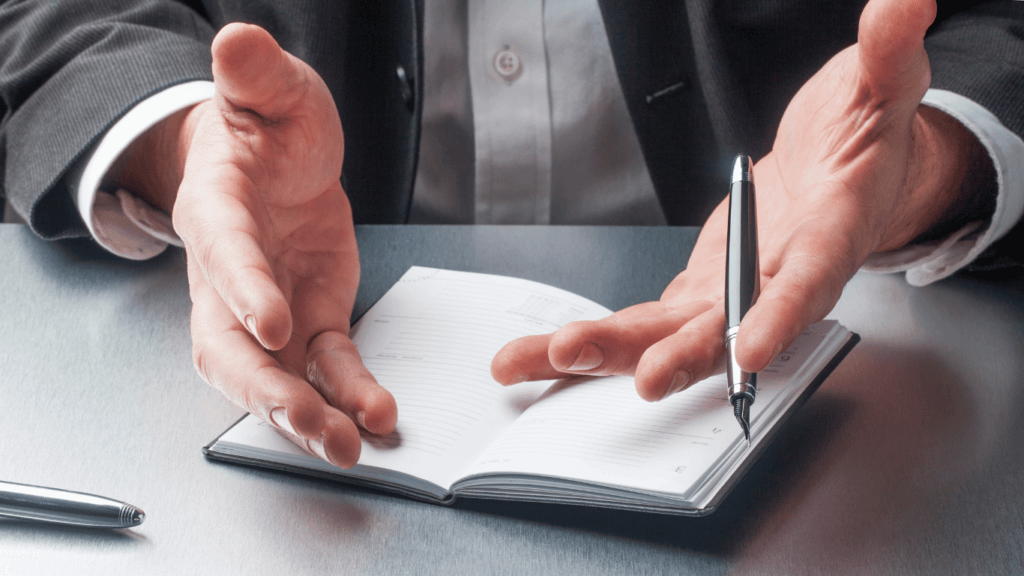 An interviewer taking down notes