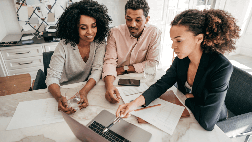 A sales professional talking to a customer and asking questions about their pain points