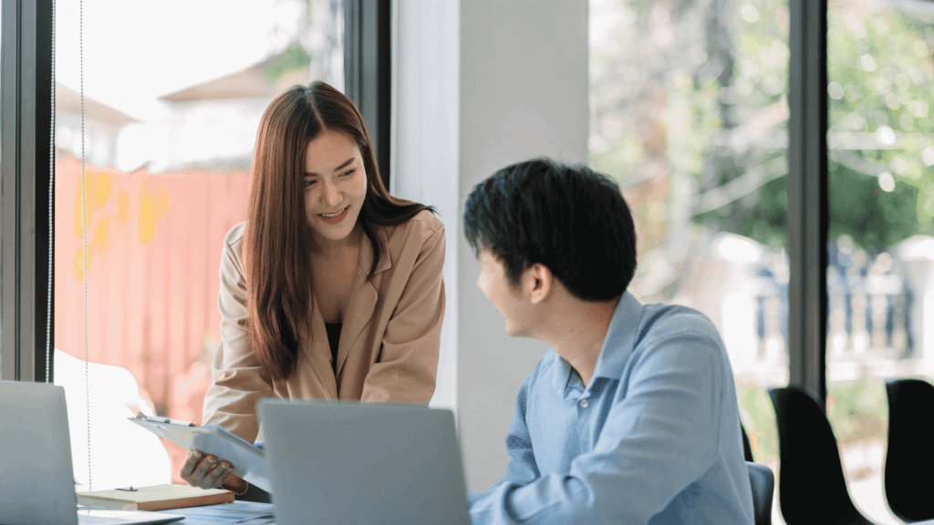 Two people discussing the differences between cold calls and cold emails
