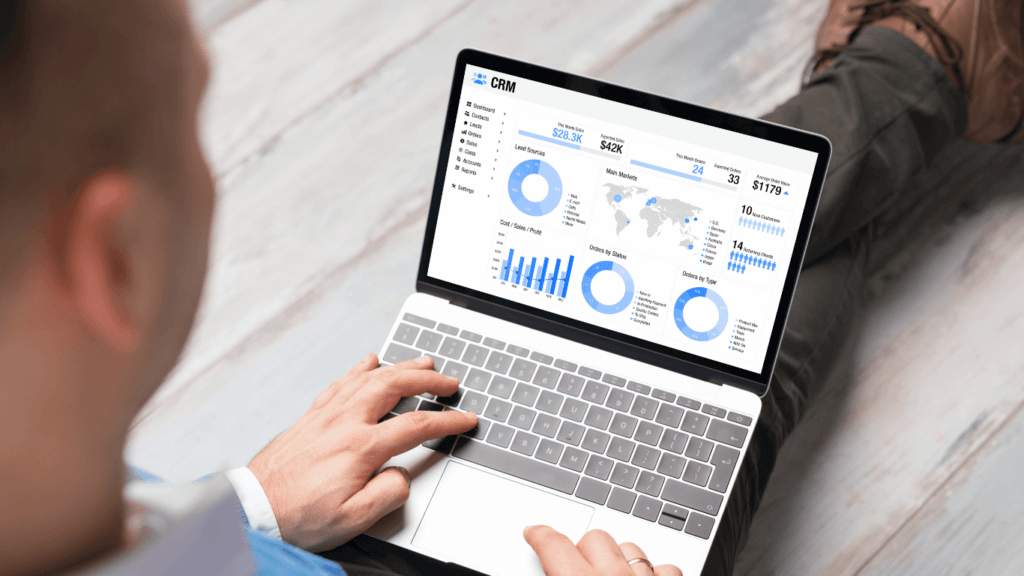 A sales rep using a sales tracking software to help with the sales process and sales tracking