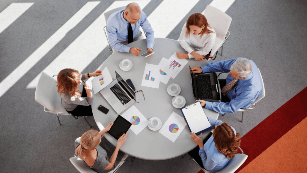 An entire sales team on their devices using sales tracking tool for lead management, sales pipeline management, sales forecasting, and studying customer data