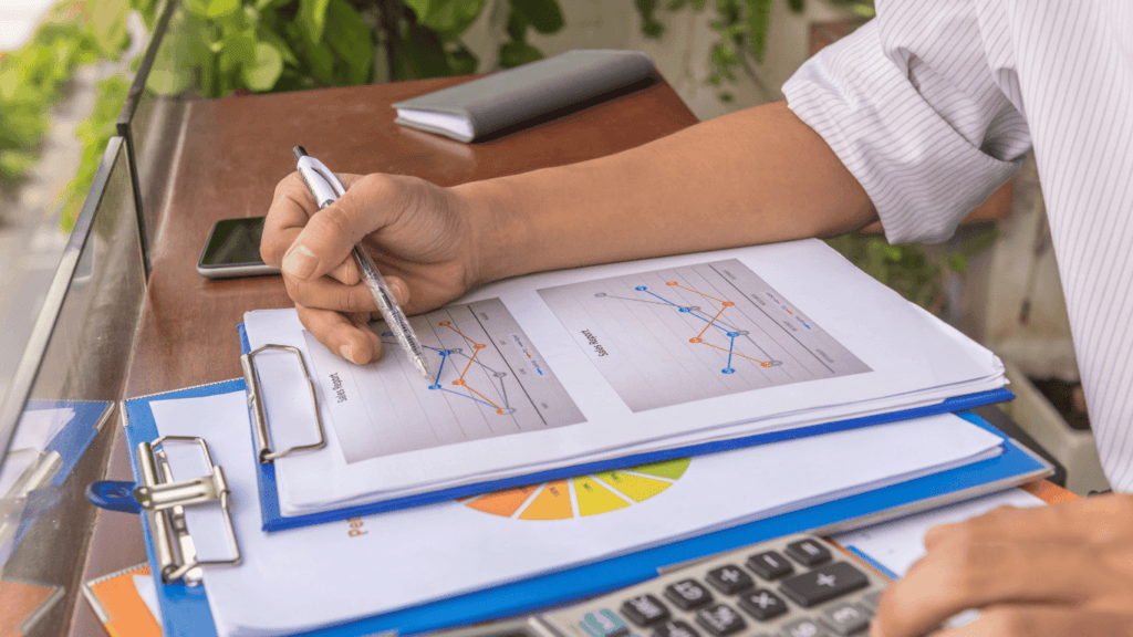 Sales team studying how to calculate lead velocity rate and actual sales revenue
