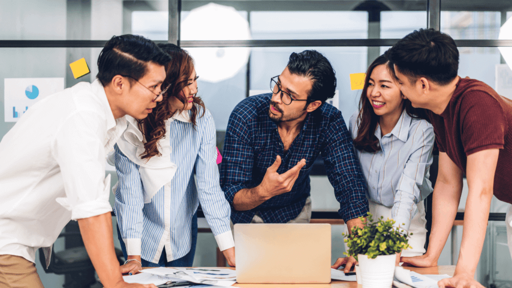 Sales managers discussing strategies with their digital marketing teams