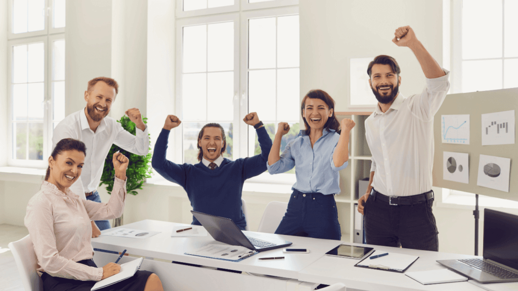Sales professionals celebrating success if the sales pipeline and sales cycle