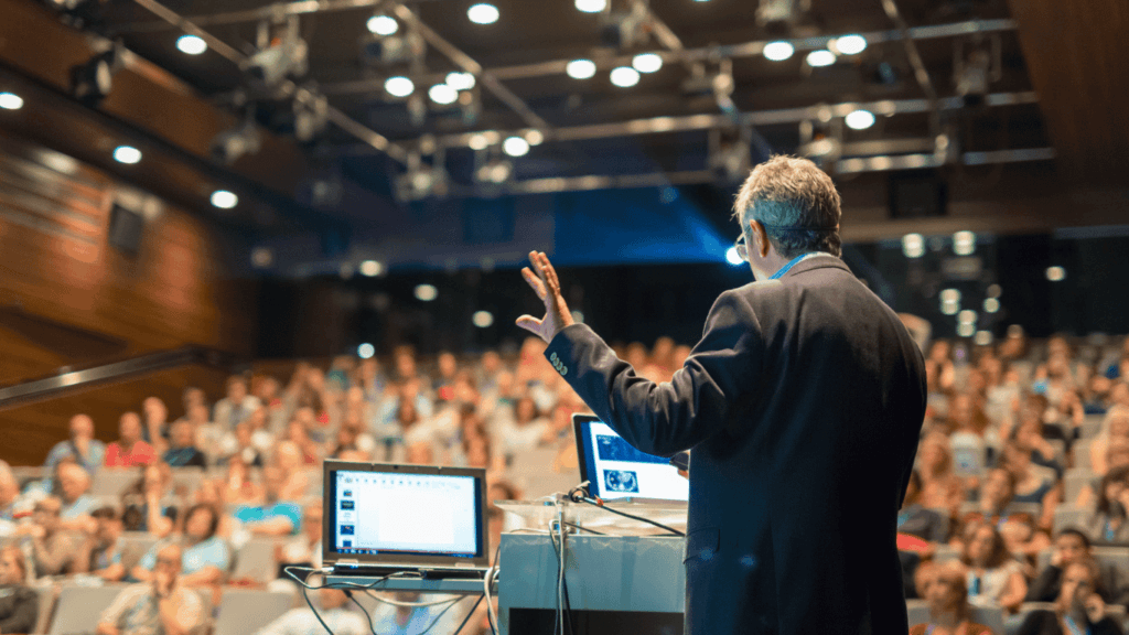 Public speaker talking in front of an audience