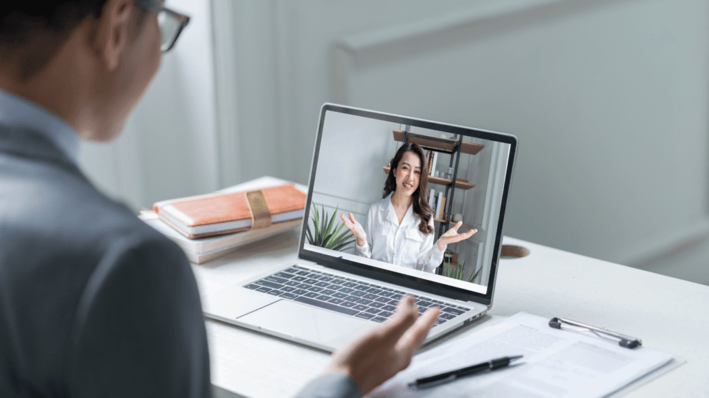 Business owner and VA talking via a video calling software about company’s culture and personal preferences